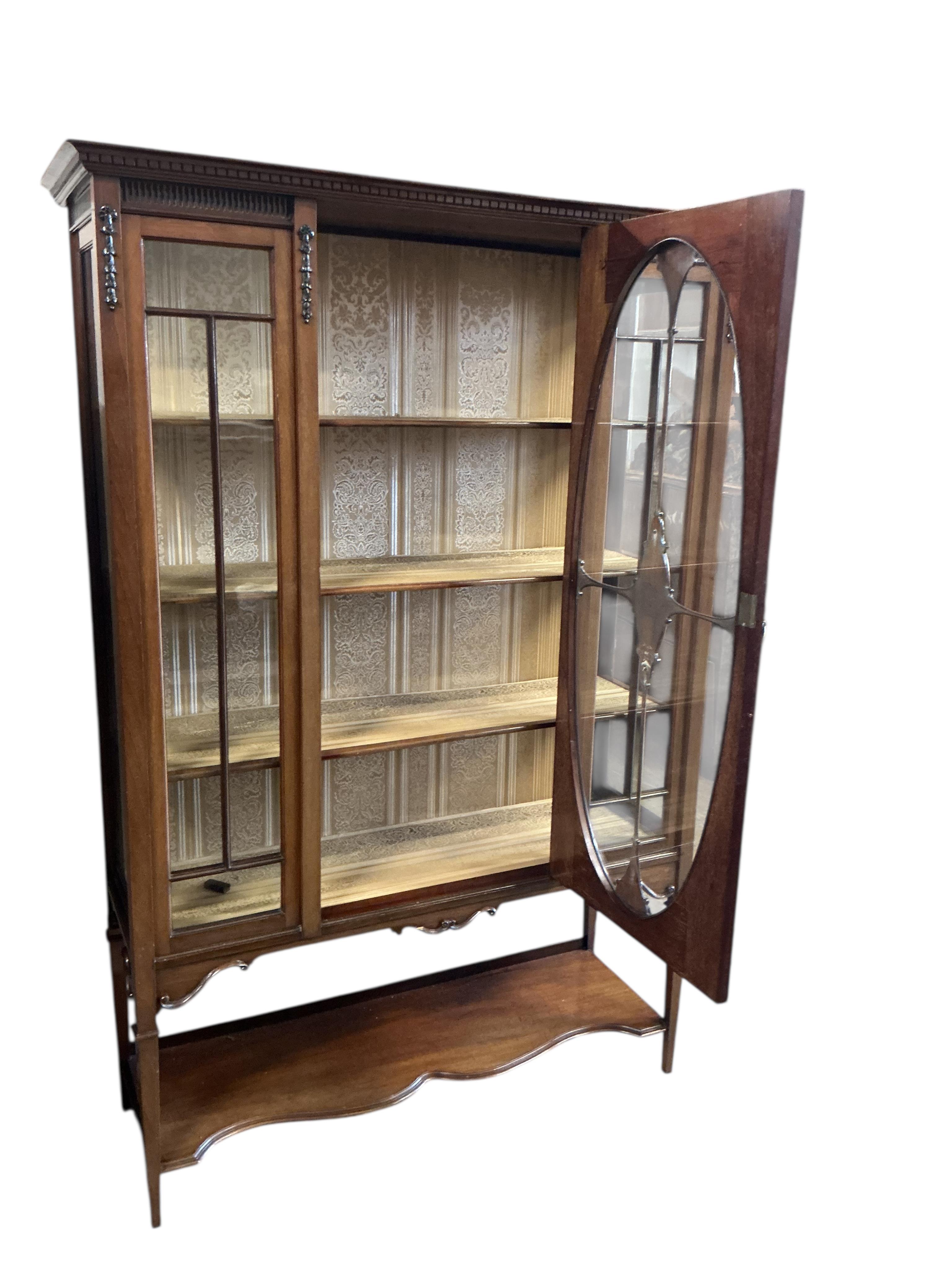 A late Victorian mahogany display cabinet, width 123cm, depth 43cm, height 180cm.